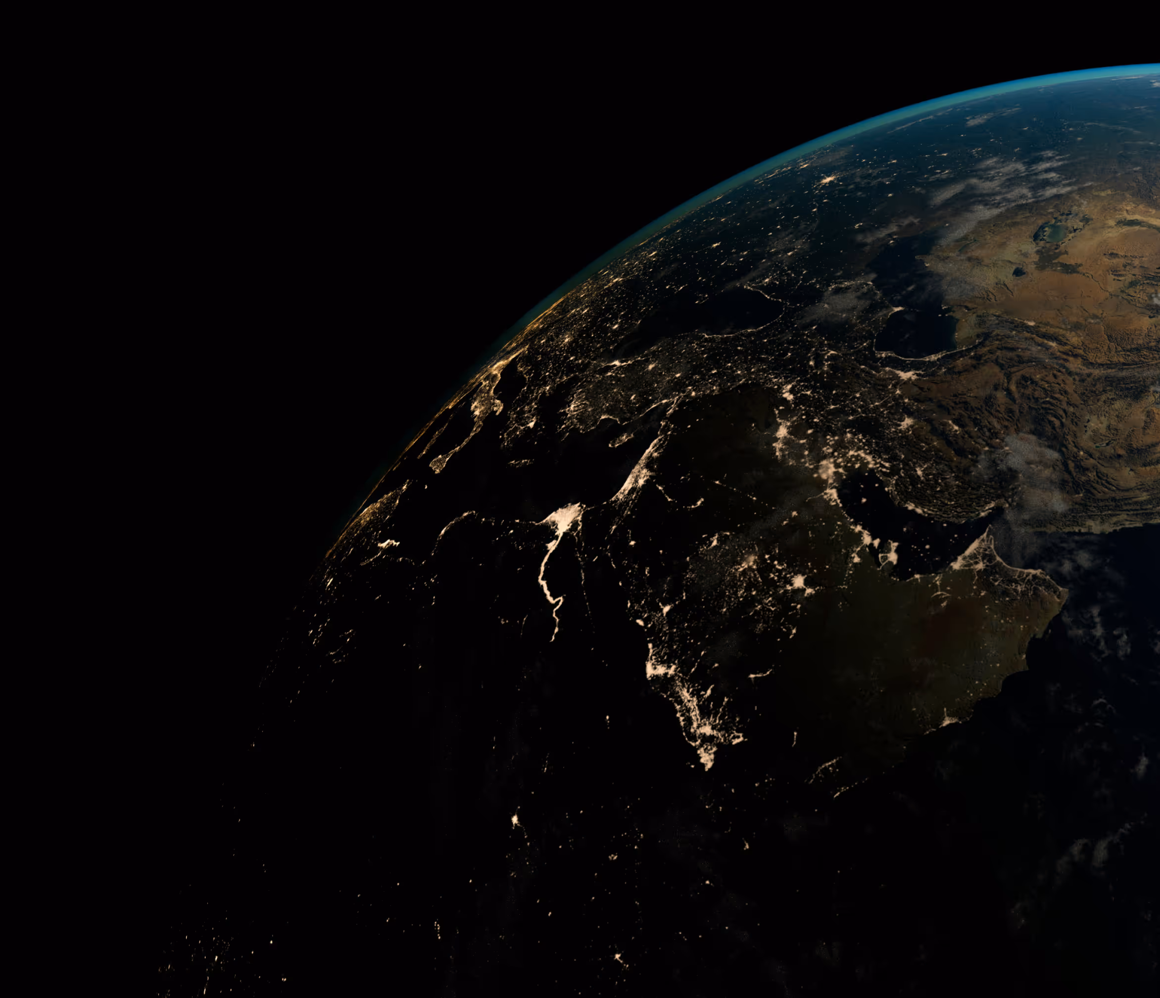 Satellite view of night lights over the Middle East and parts of South Asia, showing illuminated cities and geographical features.